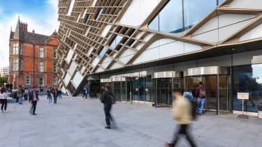 People walking outside of the Diamond building