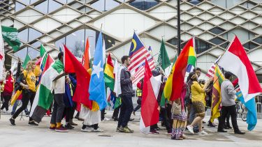 People walking with flags